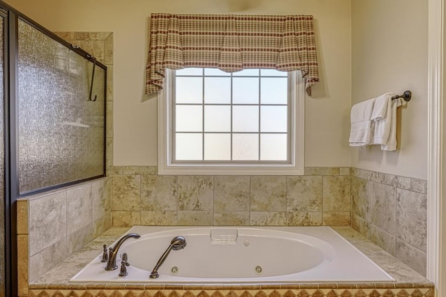 bathroom with shower with separate bathtub