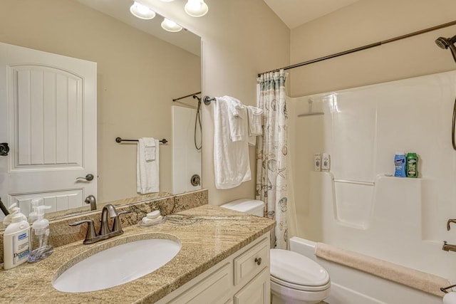 full bathroom with vanity, toilet, and shower / bath combo with shower curtain