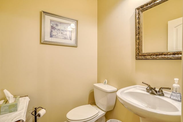 bathroom with sink and toilet