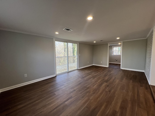 unfurnished room with crown molding and dark wood-type flooring