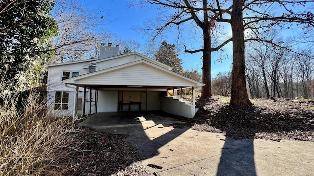 rear view of house with a carport