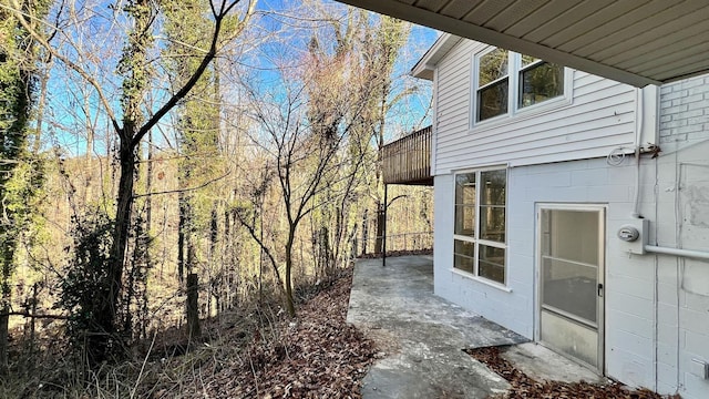 view of side of property with a patio area