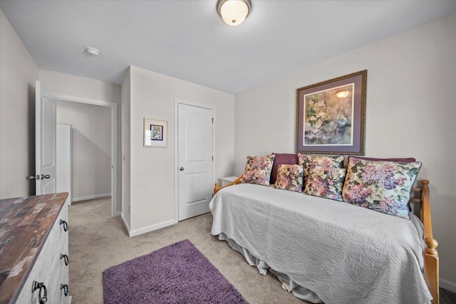 carpeted bedroom featuring a closet