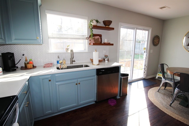 kitchen with blue cabinetry, electric range oven, dishwasher, and sink