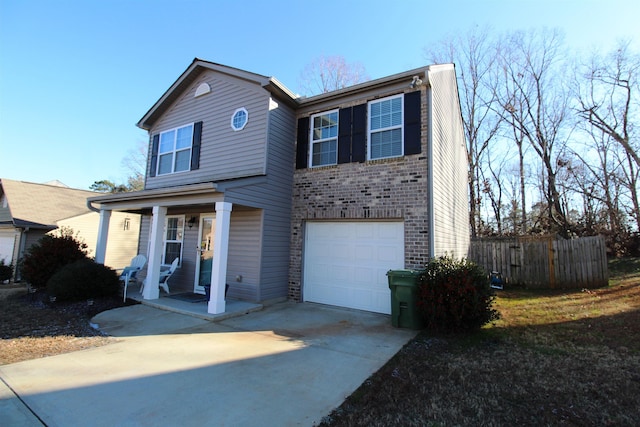 view of front of house with a porch and a garage