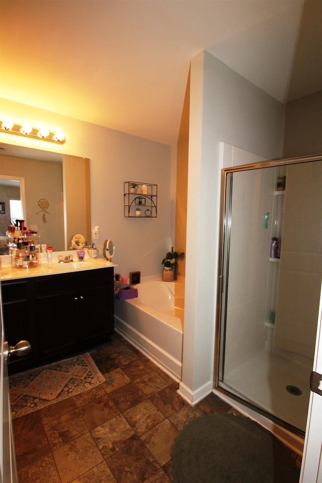 bathroom featuring vanity and separate shower and tub