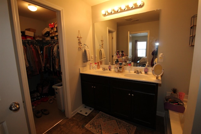 bathroom featuring vanity and tile patterned flooring