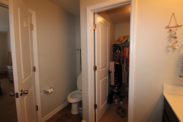 bathroom with toilet and vanity