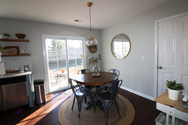 dining room featuring dark wood-type flooring