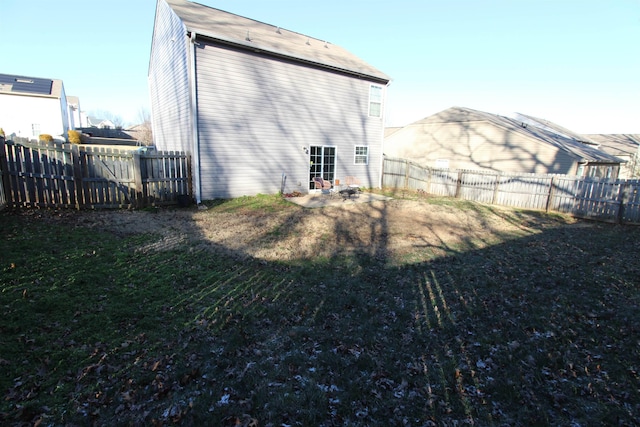 rear view of house with a lawn