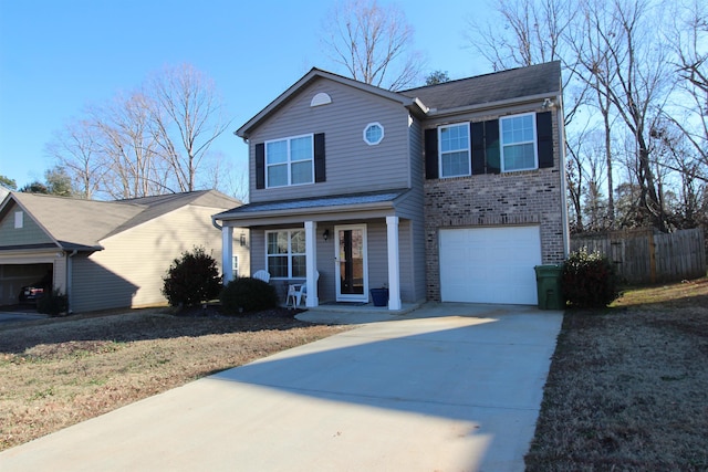 front of property with a porch and a garage