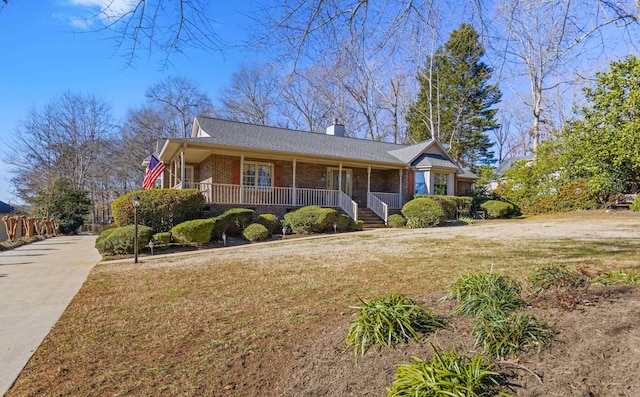 view of front of property with a porch and a front yard