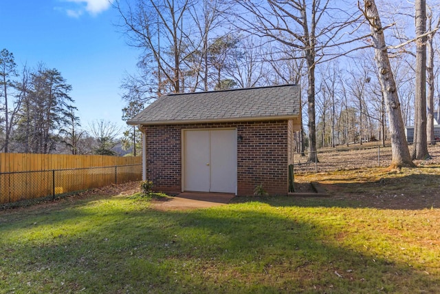 view of outdoor structure with a lawn