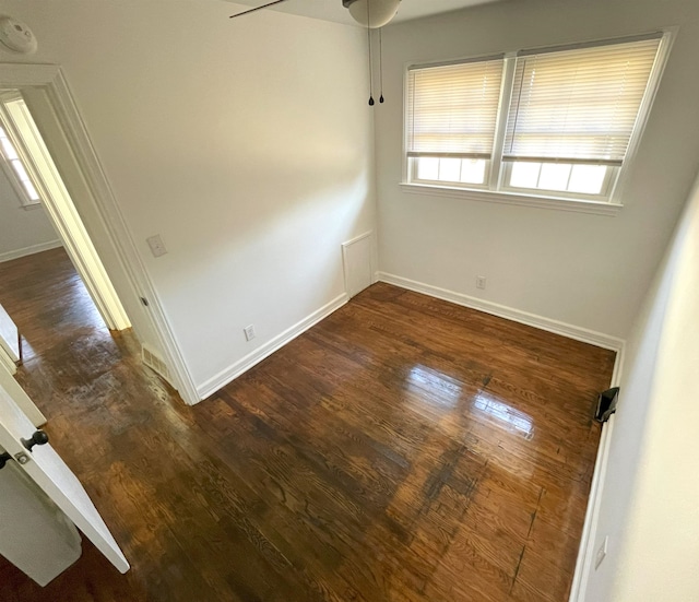 spare room with dark hardwood / wood-style flooring