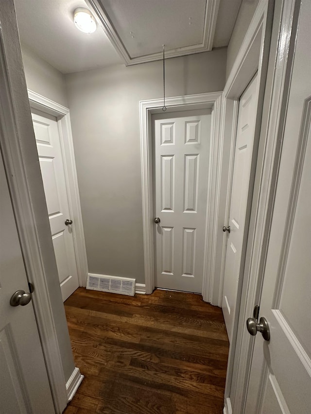 hall with dark hardwood / wood-style flooring