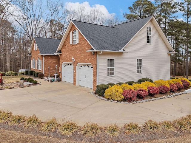 view of side of home featuring a garage