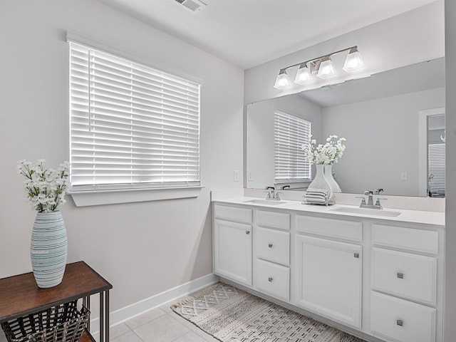 bathroom with tile patterned floors and vanity