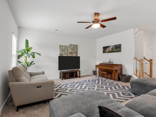 living room with ceiling fan and light carpet