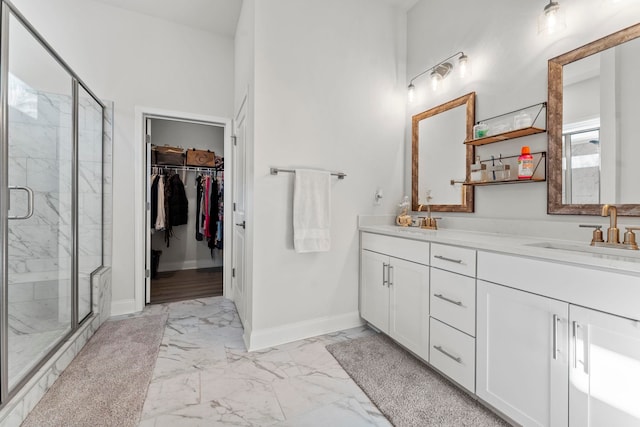 bathroom featuring walk in shower and vanity