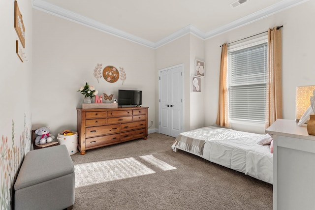 bedroom featuring carpet flooring, a closet, and ornamental molding