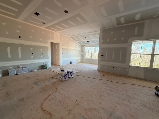 unfurnished living room with lofted ceiling