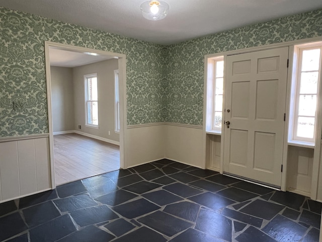 115 Fernbrook Cir, Spartanburg, SC 29307 - foyer entrance with wallpapered walls, a wealth of natural light, and a wainscoted wall