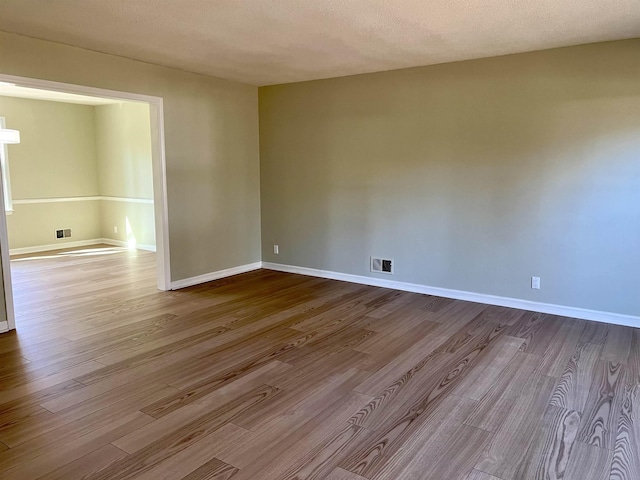 115 Fernbrook Cir, Spartanburg, SC 29307 - empty room featuring baseboards, visible vents, and dark wood-type flooring