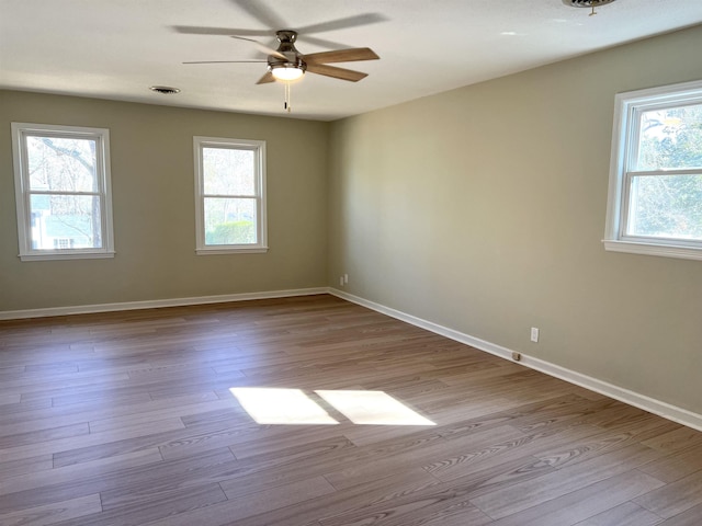 115 Fernbrook Cir, Spartanburg, SC 29307 - unfurnished room featuring a healthy amount of sunlight, baseboards, and wood finished floors