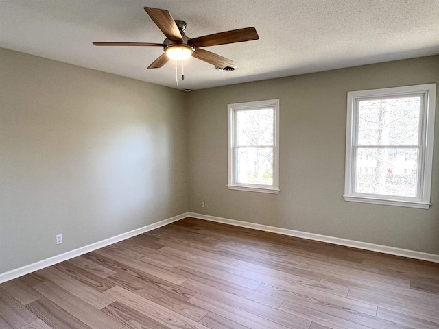 115 Fernbrook Cir, Spartanburg, SC 29307 - empty room with dark wood-type flooring, ceiling fan, a textured ceiling, and baseboards