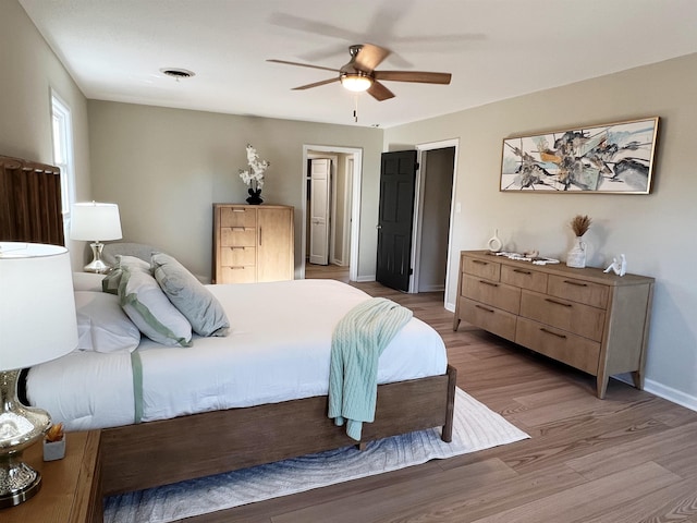 115 Fernbrook Cir, Spartanburg, SC 29307 - bedroom featuring light wood-style floors, baseboards, visible vents, and a ceiling fan