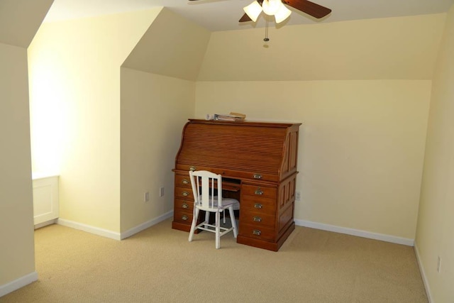 office area featuring light carpet, vaulted ceiling, and ceiling fan