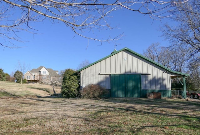 view of property exterior featuring a lawn and an outdoor structure