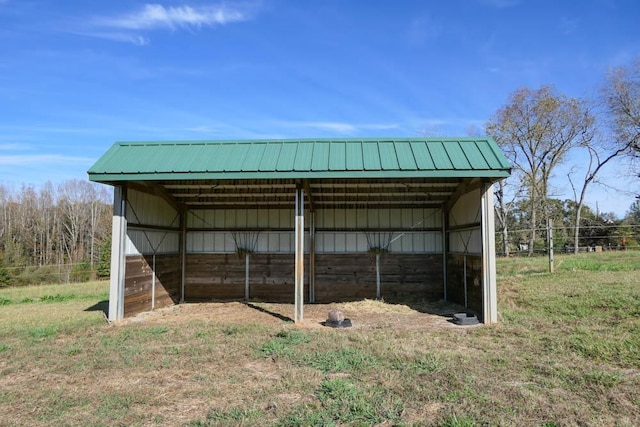 view of outdoor structure with a lawn