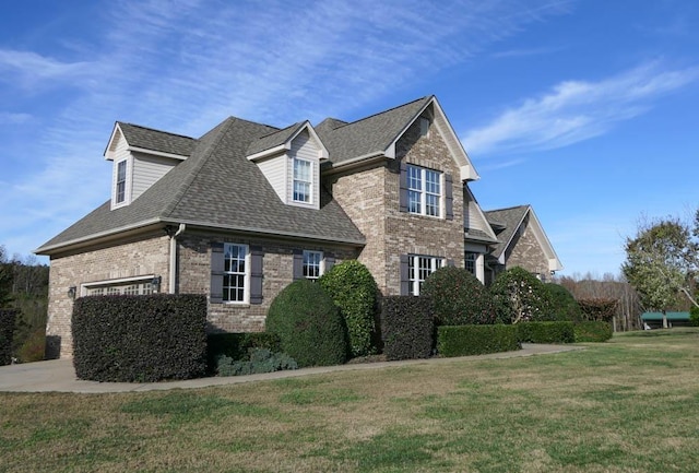 view of home's exterior featuring a lawn