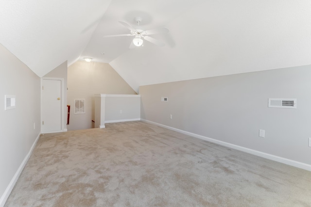 bonus room featuring ceiling fan, light colored carpet, and lofted ceiling