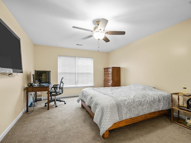 bedroom featuring ceiling fan and carpet