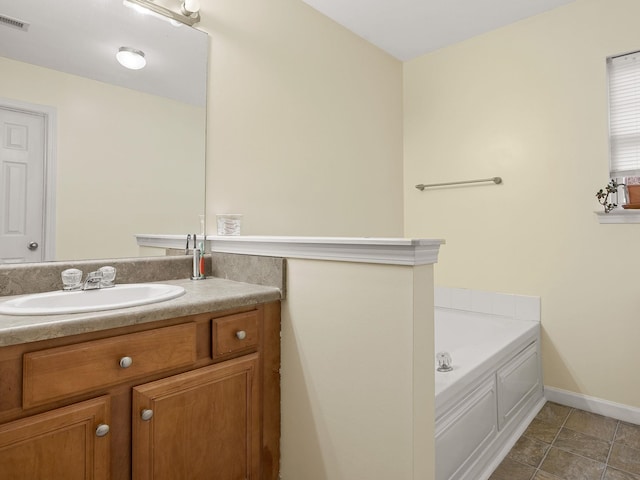 bathroom featuring vanity and a washtub