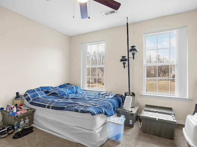 bedroom featuring ceiling fan and carpet floors