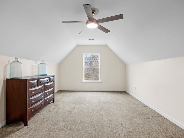 bonus room featuring ceiling fan, vaulted ceiling, and light carpet