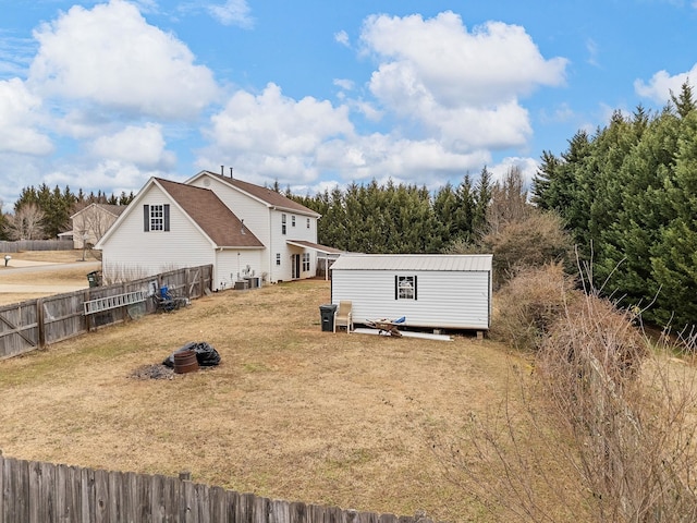 exterior space with a lawn and central air condition unit