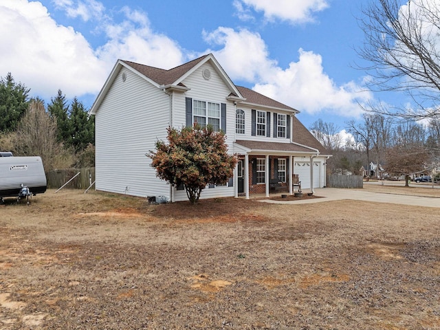 view of front of house featuring a garage and a porch