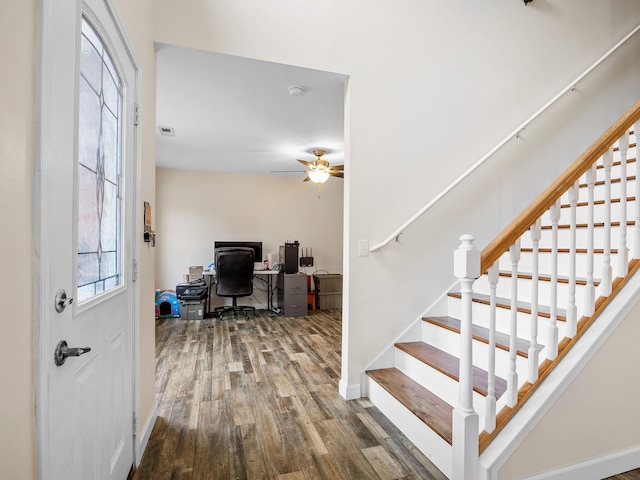 interior space with wood-type flooring and ceiling fan