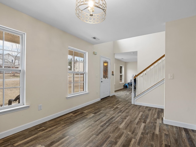 entrance foyer featuring dark hardwood / wood-style flooring