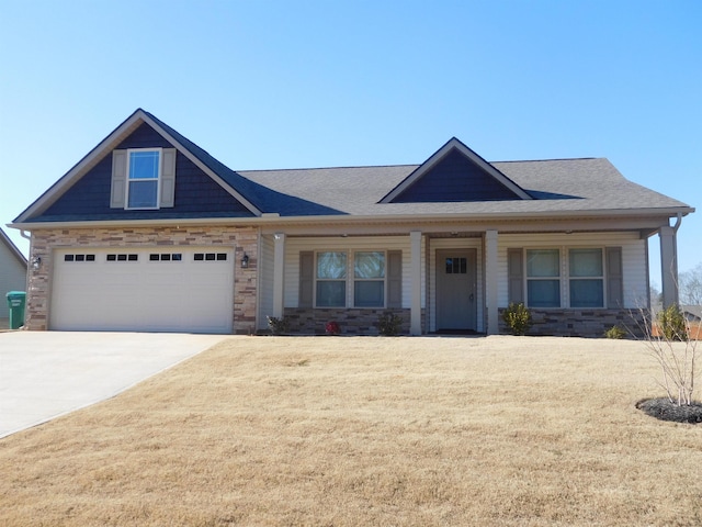 view of front of property featuring covered porch and a garage