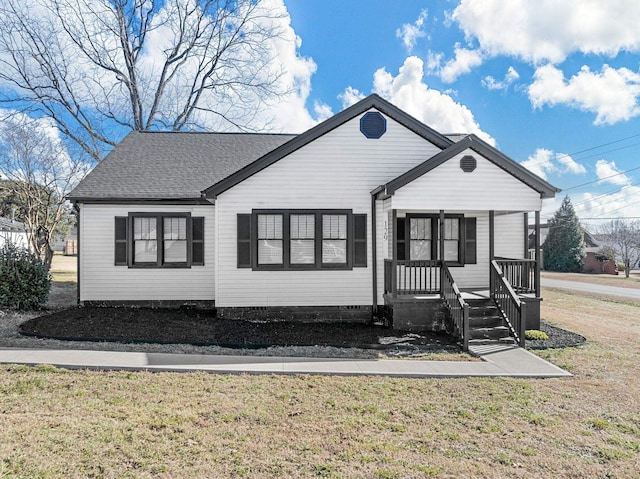 exterior space featuring a porch and a yard