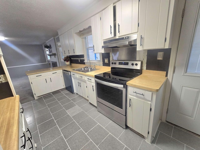 kitchen featuring sink, white cabinetry, and stainless steel appliances