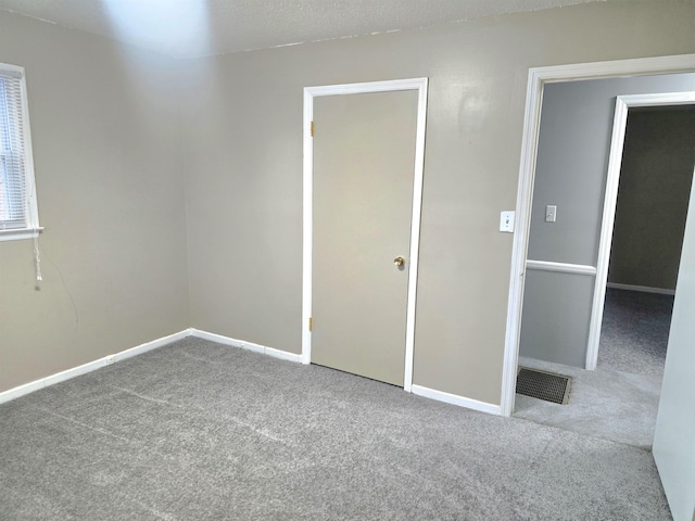 unfurnished bedroom with carpet