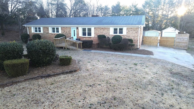 single story home with an outbuilding and a garage