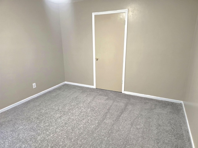 unfurnished room featuring carpet