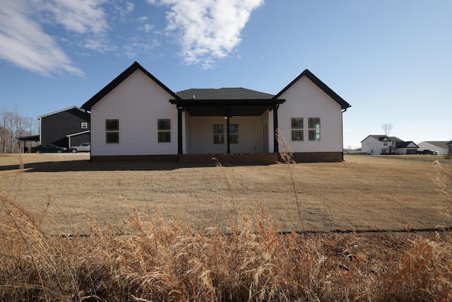 back of house with a yard